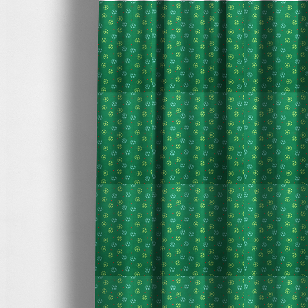 The fabric used to create these made-to-measure curtains are rich emerald green fabric featuring a playful, repeating soccer and stars pattern.