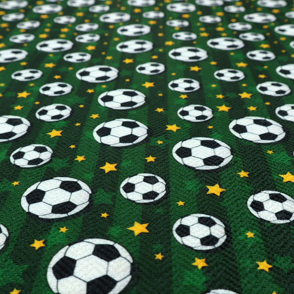 A rich forest green fabric featuring a classic, high-energy soccer and stars pattern.
