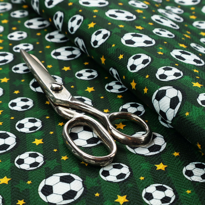 A rich forest green fabric featuring a classic, high-energy soccer and stars pattern.
