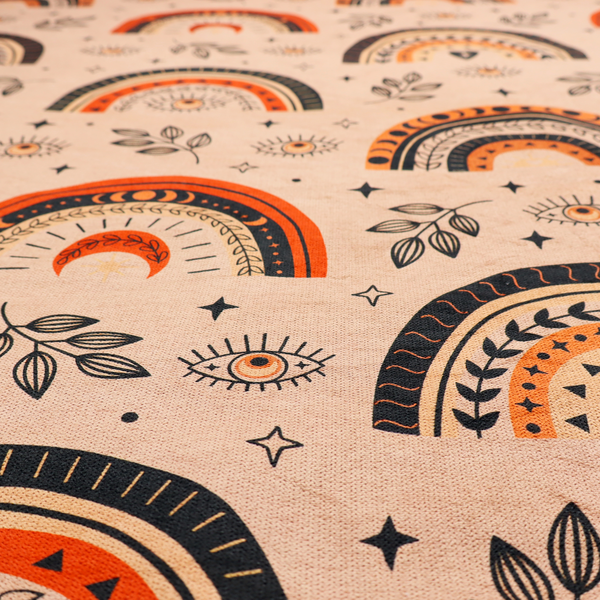 Seamless fabric pattern featuring bohemian style rainbows, mystic evil eyes, moon phases, and botanical leaves in terracotta orange, charcoal black, and tan.