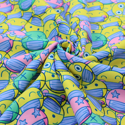 Seamless novelty fabric pattern featuring a dense, overlapping collage of cartoon emoji smiley faces wearing blue face masks in bright neon yellow, green, and pink.
