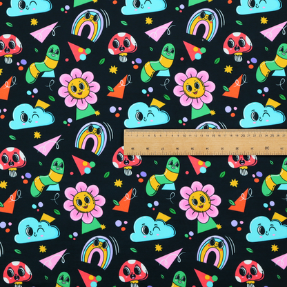 Seamless black fabric pattern featuring a colourful psychedelic print of retro cartoon mushrooms, smiling flowers, happy worms, winking clouds, and rainbow arches.