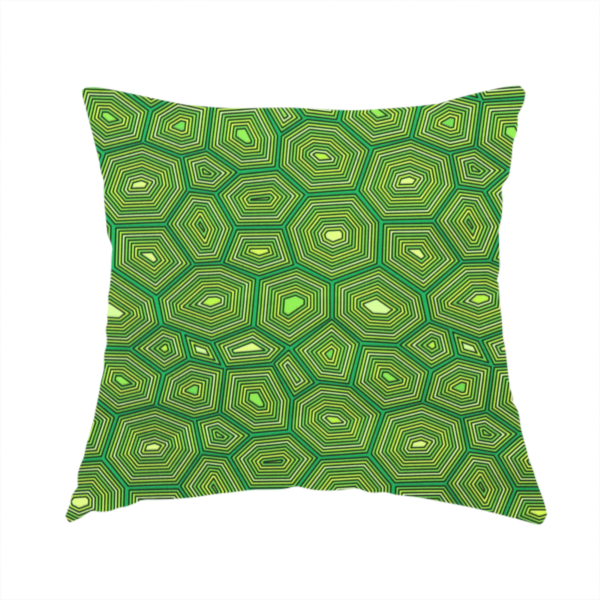 The fabric used to create this handmade cushion is a seamless green fabric pattern featuring a detailed geometric print resembling a natural tortoise or sea turtle shell with concentric lines.