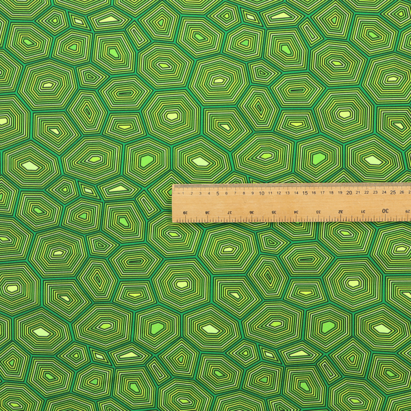 Seamless green fabric pattern featuring a detailed geometric print resembling a natural tortoise or sea turtle shell with concentric lines.