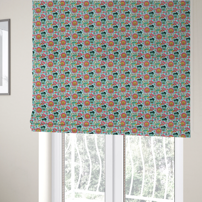 The fabric used to create these Roman blinds is a seamless light blue fabric pattern featuring a busy retro cartoon collage with smiling flowers, heart characters, pompadour men, and "WOW" comic speech bubbles.