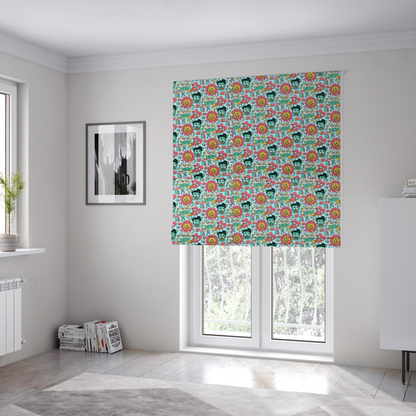 The fabric used to create these Roman blinds is a seamless light blue fabric pattern featuring a busy retro cartoon collage with smiling flowers, heart characters, pompadour men, and "WOW" comic speech bubbles.