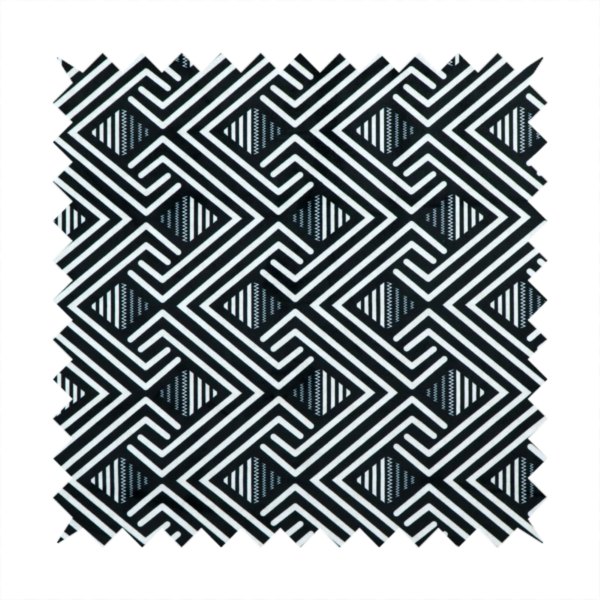 A geometric pattern featuring a repeating labyrinthine or Greek key-inspired design. The fabric has a high-contrast black and white colour scheme, with white interlocking lines forming diamond shapes and diagonal pathways against a deep black background.