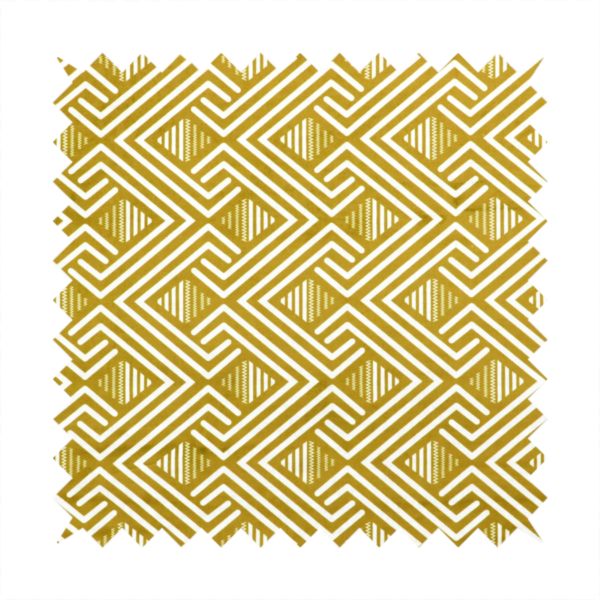 A dynamic geometric pattern with a repeating labyrinth or fretwork motif. The fabric showcases a sophisticated mustard yellow and white colour palette, with crisp white interlocking lines creating diagonal chains and diamond shapes against a warm, golden-yellow background.