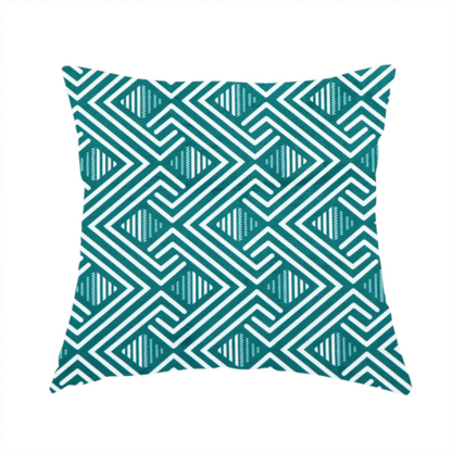 The fabric used to create this handmade cushion is a striking geometric pattern featuring an interlocking labyrinth or fretwork motif. The fabric is set in a refreshing teal and white colour palette, with crisp white lines weaving together to form diagonal chains and diamond shapes against a rich, deep sea-green background.