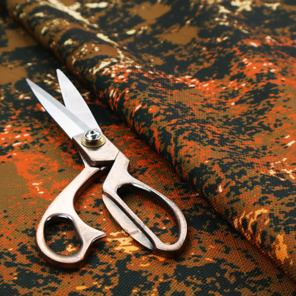 A fabric featuring a dense, distressed abstract pattern. The design mimics a weathered or "crackle" effect with a high-contrast colour palette.