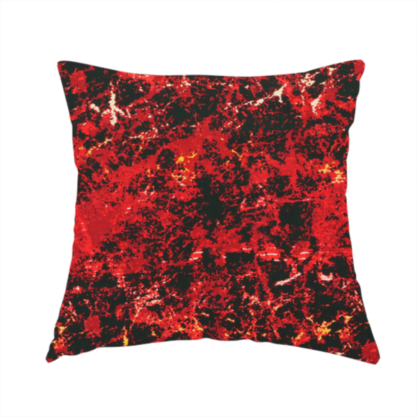 The fabric used to create this handmade cushion is a durable upholstery fabric featuring a striking, high-contrast distressed abstract pattern. This colourway is the most intense in the collection, offering a bold and dramatic aesthetic.