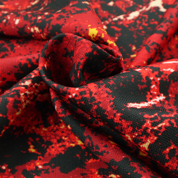 A durable upholstery fabric featuring a striking, high-contrast distressed abstract pattern. This colourway is the most intense in the collection, offering a bold and dramatic aesthetic.