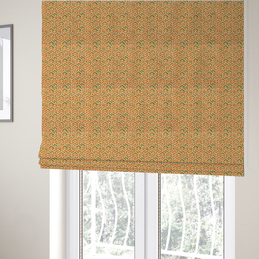 The fabric used to create these Roman blinds is a orange and white textile fabric featuring a repeating, interlocking geometric pattern. The design consists of white outlines that form three-dimensional, maze-like structures or isometric blocks against a vibrant orange background. A textured, green moss-like speckled effect is scattered across the orange spaces, adding an organic contrast to the sharp, structured geometric lines.