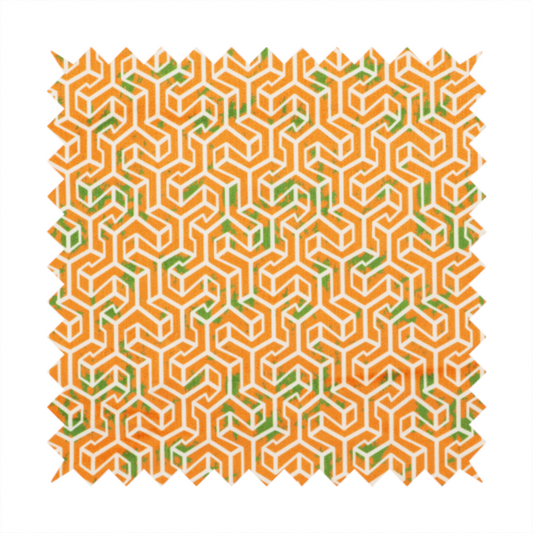 An orange and white textile fabric featuring a smaller, densely repeating interlocking geometric pattern. The design consists of fine white outlines forming complex, three-dimensional isometric block structures on an orange background. Scattered green, moss-like textured speckles are integrated throughout, creating an organic, weathered look against the sharp geometry.