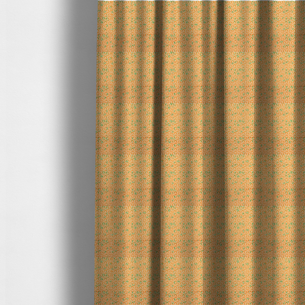 The fabric used to create these made-to-measure curtains is an orange and white textile fabric featuring a smaller, densely repeating interlocking geometric pattern. The design consists of fine white outlines forming complex, three-dimensional isometric block structures on an orange background. Scattered green, moss-like textured speckles are integrated throughout, creating an organic, weathered look against the sharp geometry.