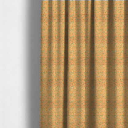 The fabric used to create these made-to-measure curtains is an orange and white textile fabric featuring a smaller, densely repeating interlocking geometric pattern. The design consists of fine white outlines forming complex, three-dimensional isometric block structures on an orange background. Scattered green, moss-like textured speckles are integrated throughout, creating an organic, weathered look against the sharp geometry.