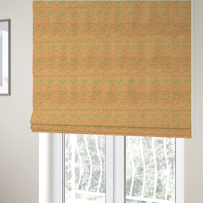 The fabric used to create these Roman blinds is a orange and white textile fabric featuring a smaller, densely repeating interlocking geometric pattern. The design consists of fine white outlines forming complex, three-dimensional isometric block structures on an orange background. Scattered green, moss-like textured speckles are integrated throughout, creating an organic, weathered look against the sharp geometry.