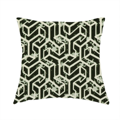 The fabric used to create this handmade cushion is a black and off-white textile fabric featuring a repeating, interlocking geometric pattern. The design consists of off-white outlines that form three-dimensional, isometric maze-like structures against a solid black background. Distressed, pale green speckled textures are subtly integrated into the background spaces, giving the sharp, structured design a weathered, organic touch.