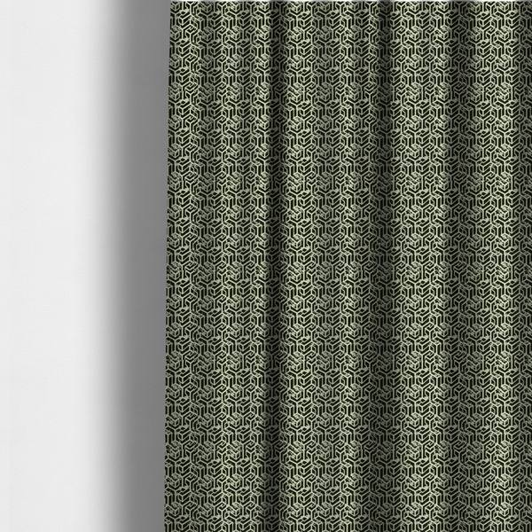 The fabric used to create these made-to-measure curtains is a black and off-white textile fabric featuring a repeating, interlocking geometric pattern. The design consists of off-white outlines that form three-dimensional, isometric maze-like structures against a solid black background. Distressed, pale green speckled textures are subtly integrated into the background spaces, giving the sharp, structured design a weathered, organic touch.