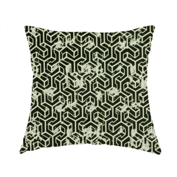 The fabric used to create this handmade cushion is a black and off-white textile fabric featuring a small-scale, densely repeating interlocking geometric pattern. Fine off-white outlines construct complex, three-dimensional isometric block formations against a solid black background. Pale green, distressed textured speckles are integrated throughout, creating a weathered, organic contrast to the sharp geometric structure.