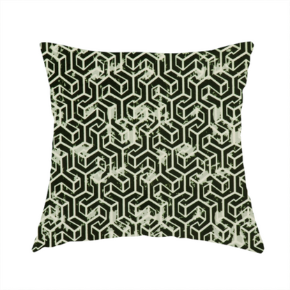 The fabric used to create this handmade cushion is a black and off-white textile fabric featuring a small-scale, densely repeating interlocking geometric pattern. Fine off-white outlines construct complex, three-dimensional isometric block formations against a solid black background. Pale green, distressed textured speckles are integrated throughout, creating a weathered, organic contrast to the sharp geometric structure.