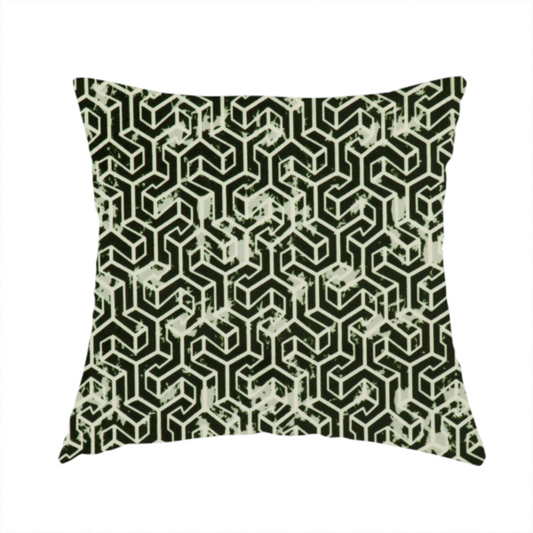 The fabric used to create this handmade cushion is a black and off-white textile fabric featuring a small-scale, densely repeating interlocking geometric pattern. Fine off-white outlines construct complex, three-dimensional isometric block formations against a solid black background. Pale green, distressed textured speckles are integrated throughout, creating a weathered, organic contrast to the sharp geometric structure.