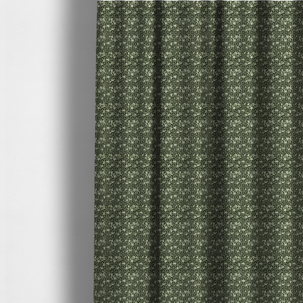 The fabric used to create these made-to-measure curtains is a black and off-white textile fabric featuring a small-scale, densely repeating interlocking geometric pattern. Fine off-white outlines construct complex, three-dimensional isometric block formations against a solid black background. Pale green, distressed textured speckles are integrated throughout, creating a weathered, organic contrast to the sharp geometric structure.