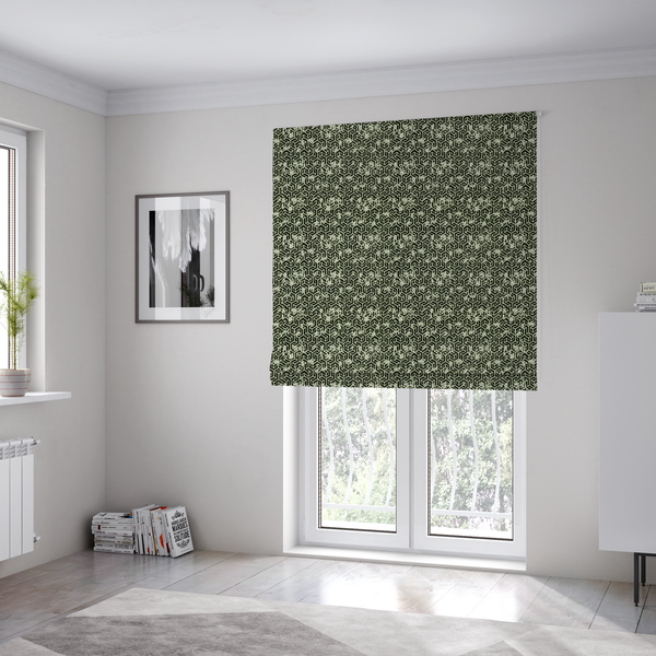 The fabric used to create these Roman blinds is a black and off-white textile fabric featuring a small-scale, densely repeating interlocking geometric pattern. Fine off-white outlines construct complex, three-dimensional isometric block formations against a solid black background. Pale green, distressed textured speckles are integrated throughout, creating a weathered, organic contrast to the sharp geometric structure.