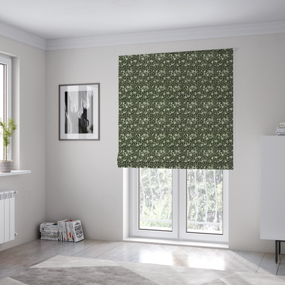 The fabric used to create these Roman blinds is a black and off-white textile fabric featuring a small-scale, densely repeating interlocking geometric pattern. Fine off-white outlines construct complex, three-dimensional isometric block formations against a solid black background. Pale green, distressed textured speckles are integrated throughout, creating a weathered, organic contrast to the sharp geometric structure.