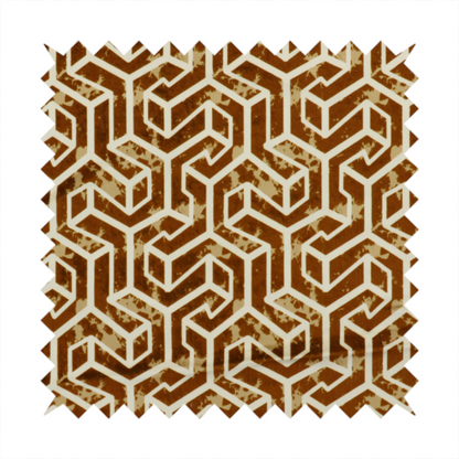 A brown and cream textile fabric featuring a repeating, interlocking geometric pattern. The design consists of cream-colored outlines forming three-dimensional, isometric maze-like structures against a warm, dark brown background. Lightly distressed, tan-speckled textures are subtly scattered throughout the brown spaces, adding a weathered, organic feel to the structured, geometric design.