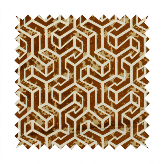 A brown and cream textile fabric featuring a repeating, interlocking geometric pattern. The design consists of cream-colored outlines forming three-dimensional, isometric maze-like structures against a warm, dark brown background. Lightly distressed, tan-speckled textures are subtly scattered throughout the brown spaces, adding a weathered, organic feel to the structured, geometric design.