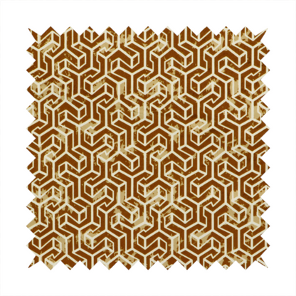 A brown and cream textile fabric featuring a small-scale, densely repeating interlocking geometric pattern. Fine cream-coloured outlines construct complex, three-dimensional isometric block formations against a warm, dark brown background. Lightly distressed, tan-speckled textures are integrated throughout, creating a weathered, organic contrast to the sharp geometric structure.