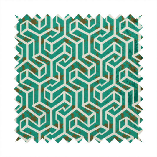 A teal and off-white textile fabric featuring a repeating, interlocking geometric pattern. The design consists of off-white outlines forming three-dimensional, isometric maze-like structures against a deep teal background. Distressed, brown speckled textures are subtly scattered throughout the teal spaces, giving the structured, geometric layout a weathered, organic touch.