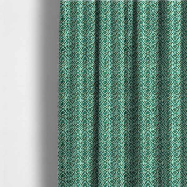 The fabric used to create these made-to-measure curtains is a teal and off-white textile fabric featuring a repeating, interlocking geometric pattern. The design consists of off-white outlines forming three-dimensional, isometric maze-like structures against a deep teal background. Distressed, brown speckled textures are subtly scattered throughout the teal spaces, giving the structured, geometric layout a weathered, organic touch.