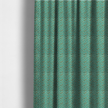 The fabric used to create these made-to-measure curtains is a teal and off-white textile fabric featuring a repeating, interlocking geometric pattern. The design consists of off-white outlines forming three-dimensional, isometric maze-like structures against a deep teal background. Distressed, brown speckled textures are subtly scattered throughout the teal spaces, giving the structured, geometric layout a weathered, organic touch.