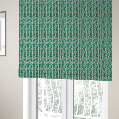 The fabric used to create these Roman blinds is a teal and off-white textile fabric featuring a repeating, interlocking geometric pattern. The design consists of off-white outlines forming three-dimensional, isometric maze-like structures against a deep teal background. Distressed, brown speckled textures are subtly scattered throughout the teal spaces, giving the structured, geometric layout a weathered, organic touch.