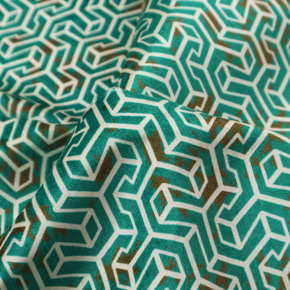 A teal and off-white textile fabric featuring a small-scale, densely repeating interlocking geometric pattern. Fine off-white outlines construct complex, three-dimensional isometric block formations against a deep teal background. Distressed, brown-speckled textures are integrated throughout, creating a weathered, organic contrast to the sharp geometric structure.