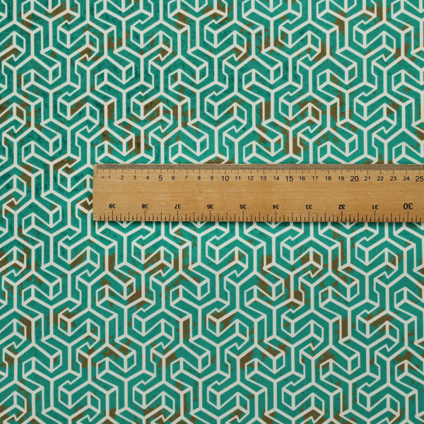 A teal and off-white textile fabric featuring a small-scale, densely repeating interlocking geometric pattern. Fine off-white outlines construct complex, three-dimensional isometric block formations against a deep teal background. Distressed, brown-speckled textures are integrated throughout, creating a weathered, organic contrast to the sharp geometric structure.