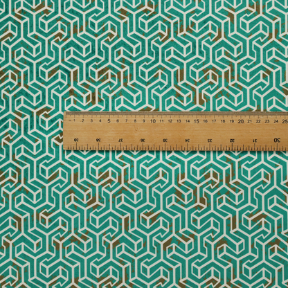 A teal and off-white textile fabric featuring a small-scale, densely repeating interlocking geometric pattern. Fine off-white outlines construct complex, three-dimensional isometric block formations against a deep teal background. Distressed, brown-speckled textures are integrated throughout, creating a weathered, organic contrast to the sharp geometric structure.
