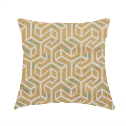 The fabric used to create this handmade cushion is a beige and off-white textile fabric featuring a repeating, interlocking geometric pattern. The design consists of off-white outlines forming three-dimensional, isometric maze-like structures against a warm beige background. Distressed, pale green-blue speckled textures are subtly scattered throughout the beige spaces, giving the structured, geometric layout a weathered, organic touch.
