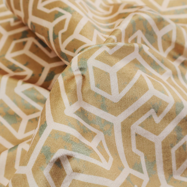 A beige and off-white textile fabric featuring a repeating, interlocking geometric pattern. The design consists of off-white outlines forming three-dimensional, isometric maze-like structures against a warm beige background. Distressed, pale green-blue speckled textures are subtly scattered throughout the beige spaces, giving the structured, geometric layout a weathered, organic touch.