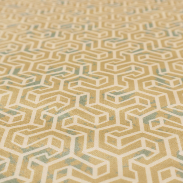 A beige and off-white textile fabric featuring a small-scale, densely repeating interlocking geometric pattern. Fine off-white outlines construct complex, three-dimensional isometric block formations against a warm beige background. Distressed, pale green-blue speckled textures are integrated throughout, creating a weathered, organic contrast to the sharp geometric structure.