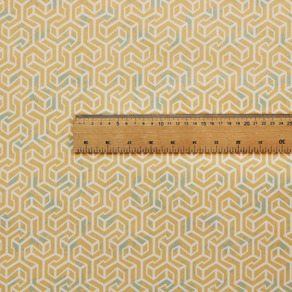 A beige and off-white textile fabric featuring a small-scale, densely repeating interlocking geometric pattern. Fine off-white outlines construct complex, three-dimensional isometric block formations against a warm beige background. Distressed, pale green-blue speckled textures are integrated throughout, creating a weathered, organic contrast to the sharp geometric structure.