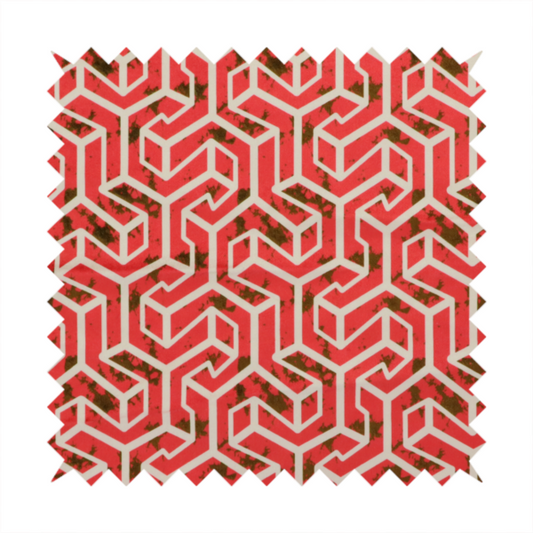 A red and off-white textile fabric featuring a repeating, interlocking geometric pattern. The design consists of off-white outlines forming three-dimensional, isometric maze-like structures against a vibrant coral red background. Distressed, dark brown speckled textures are subtly scattered throughout the red spaces, adding a weathered, organic touch to the structured, geometric design.