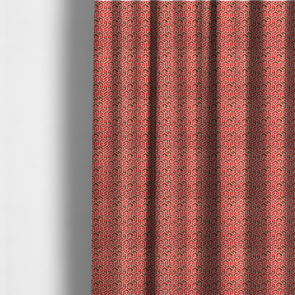 The fabric used to create these made-to-measure curtains is a red and off-white textile fabric featuring a repeating, interlocking geometric pattern. The design consists of off-white outlines forming three-dimensional, isometric maze-like structures against a vibrant coral red background. Distressed, dark brown speckled textures are subtly scattered throughout the red spaces, adding a weathered, organic touch to the structured, geometric design.