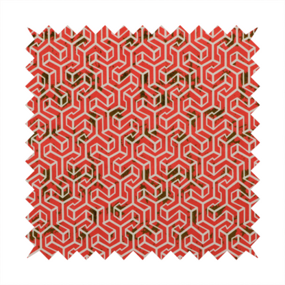 A coral red and off-white textile fabric featuring a small-scale, densely repeating interlocking geometric pattern. Fine off-white outlines construct complex, three-dimensional isometric block formations against a vibrant coral red background. Distressed, dark brown speckled textures are integrated throughout, creating a weathered, organic contrast to the sharp geometric structure.