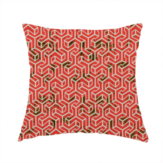 The fabric used to create this handmade cushion is a coral red and off-white textile fabric featuring a small-scale, densely repeating interlocking geometric pattern. Fine off-white outlines construct complex, three-dimensional isometric block formations against a vibrant coral red background. Distressed, dark brown speckled textures are integrated throughout, creating a weathered, organic contrast to the sharp geometric structure.
