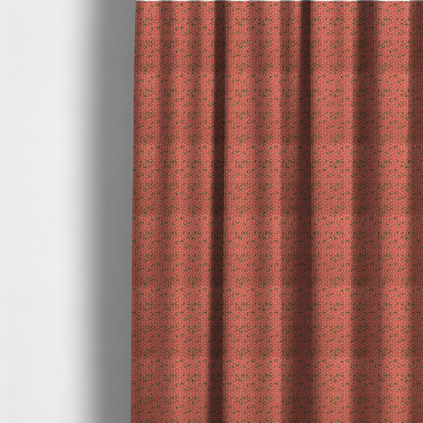 The fabric used to create these made-to-measure curtains is a coral red and off-white textile fabric featuring a small-scale, densely repeating interlocking geometric pattern. Fine off-white outlines construct complex, three-dimensional isometric block formations against a vibrant coral red background. Distressed, dark brown speckled textures are integrated throughout, creating a weathered, organic contrast to the sharp geometric structure.