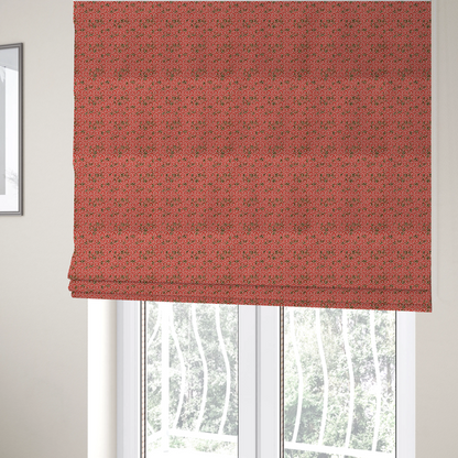 The fabric used to create these Roman blinds is a coral red and off-white textile fabric featuring a small-scale, densely repeating interlocking geometric pattern. Fine off-white outlines construct complex, three-dimensional isometric block formations against a vibrant coral red background. Distressed, dark brown speckled textures are integrated throughout, creating a weathered, organic contrast to the sharp geometric structure.