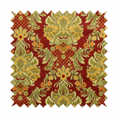 An ornate damask fabric featuring large, symmetrical floral medallions in shades of sage green, golden ochre, and muted orange.